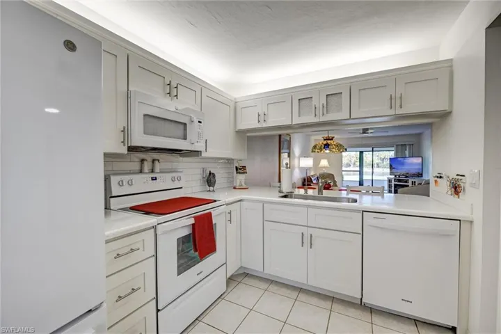 Newer upper and lower cabinets and preferred large undivided sink