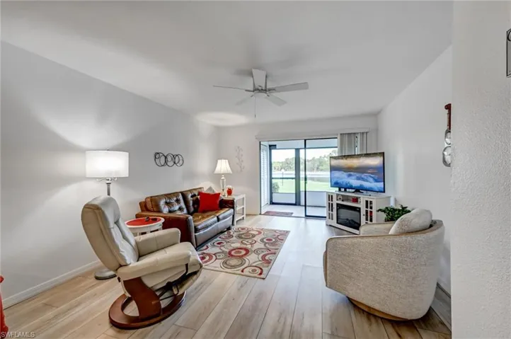 Spacious living room with new luxury vinyl wide plank flooring
