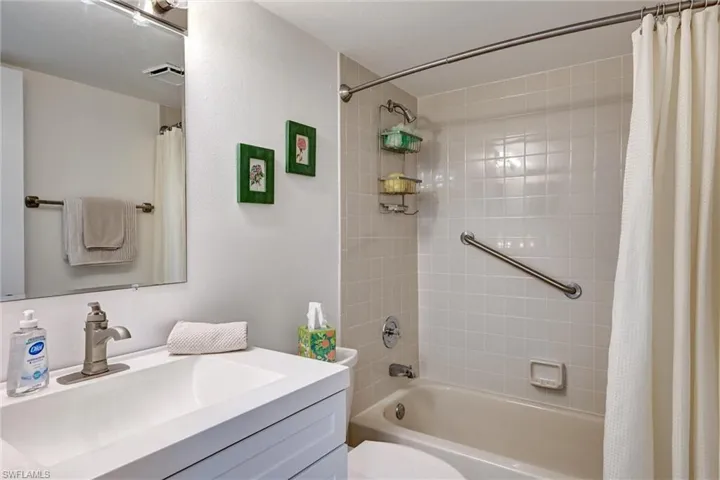 Updated guest bath with combo tub / shower and grab bar