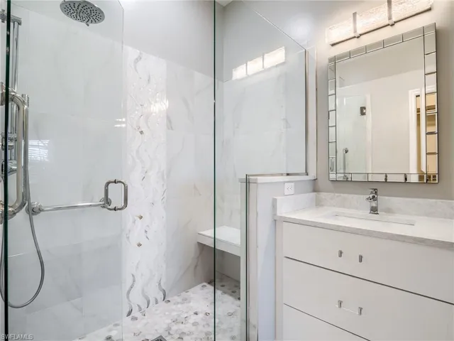 Bathroom featuring vanity and walk in shower