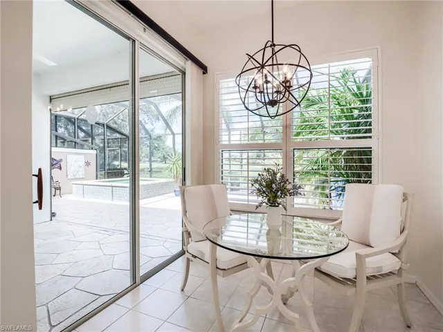 Tiled dining area with a notable chandelier