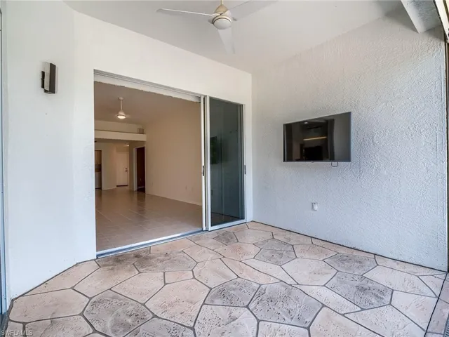 View of patio featuring ceiling fan