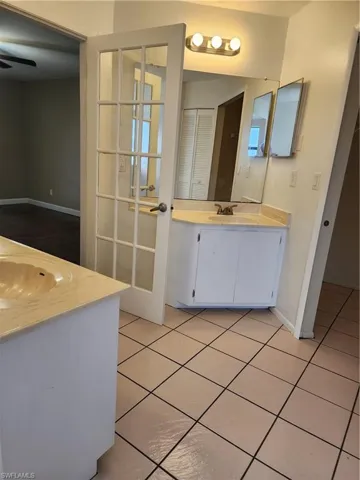 Bathroom with vanity and tile patterned floors