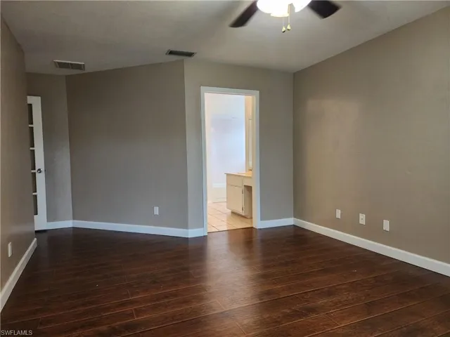 Empty room featuring ceiling fan and wood finished floors