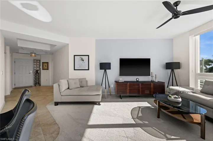 Living area featuring ceiling fan