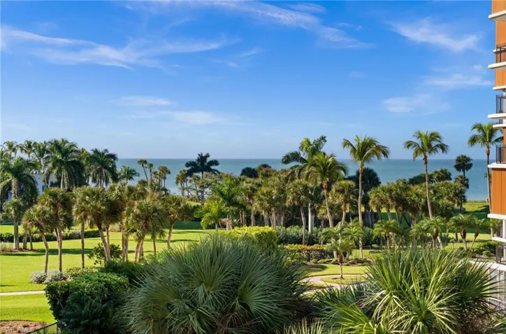 View of home's community featuring a yard and a water view