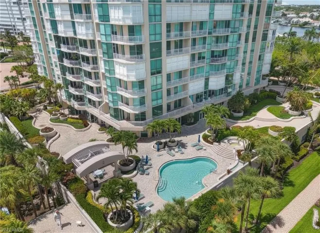 Aerial view of apartment complex and a pool
