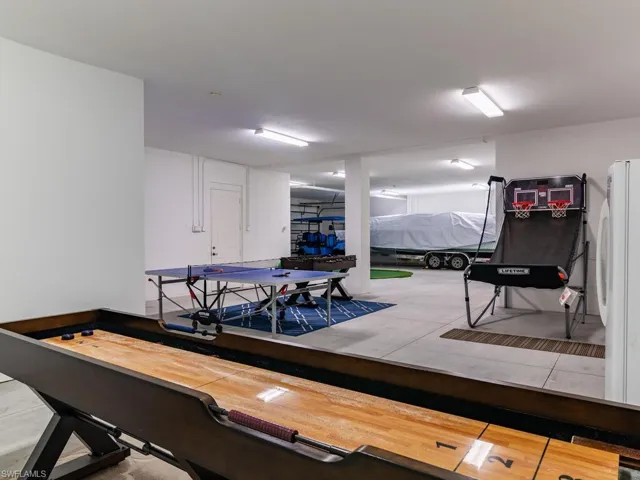 Recreation room with hardwood / wood-style floors