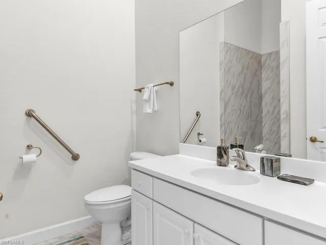 Bathroom with vanity and toilet