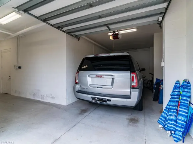 Garage featuring a garage door opener