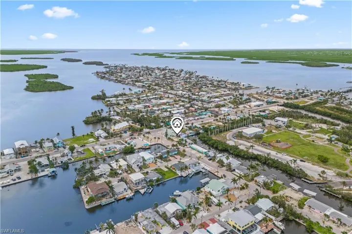 Enjoy stunning aerial views of the Gulf from this rare waterfront lot in Matlacha.