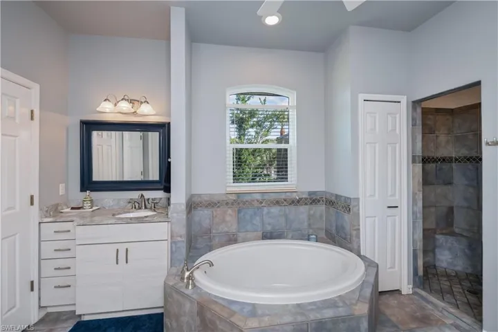 Large Master Bath with separate vanities and separate tub and shower