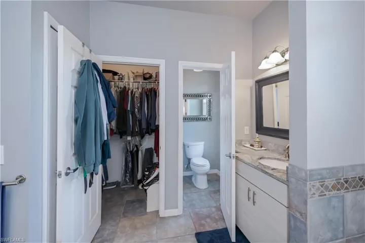 Master bedroom features two walk in closets