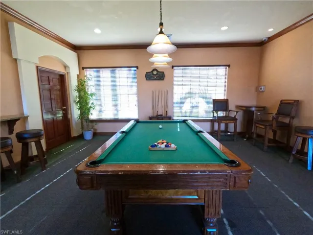 Playroom with pool table, crown molding, plenty of natural light, and recessed lighting