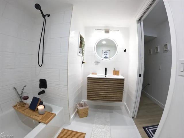 Full bath with vanity and tub / shower combination