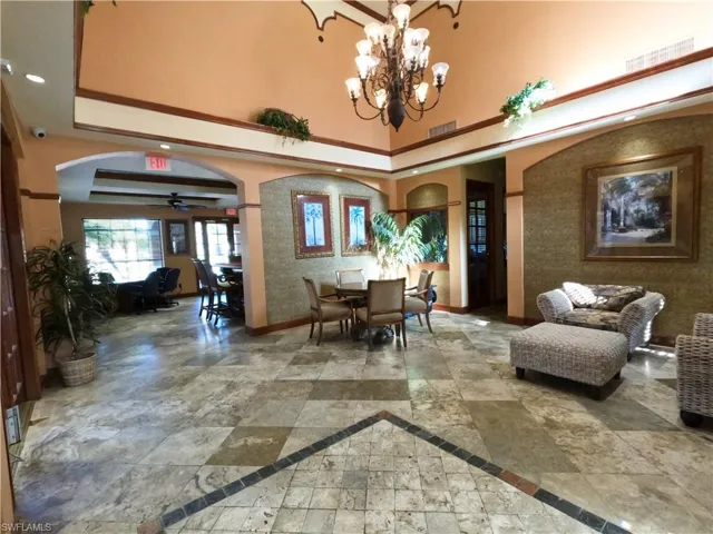 Building lobby featuring a high ceiling and recessed lighting