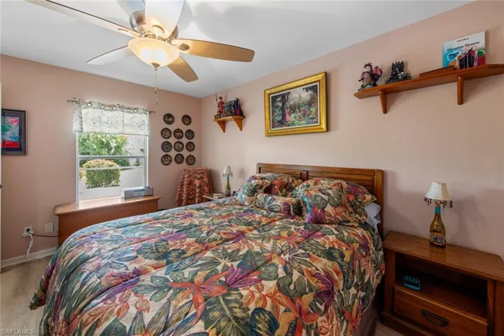 Bedroom featuring ceiling fan and baseboards
