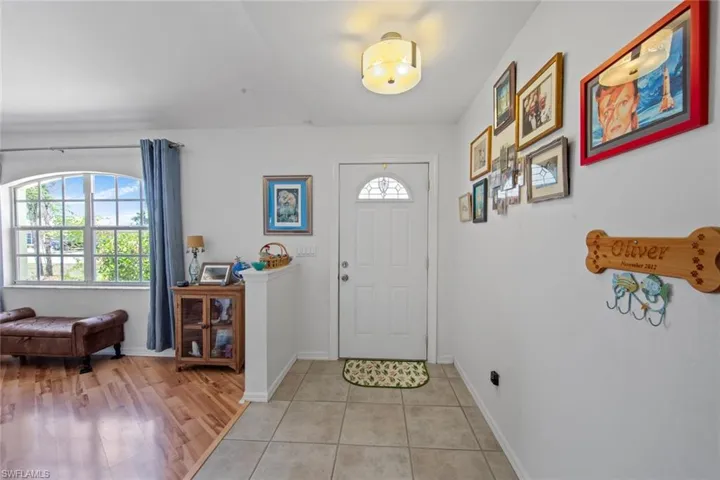 Foyer entrance featuring baseboards