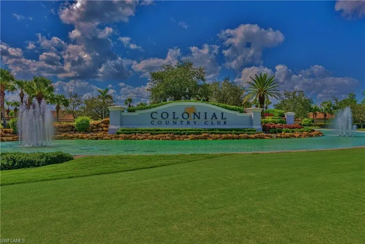 Community sign featuring a lawn