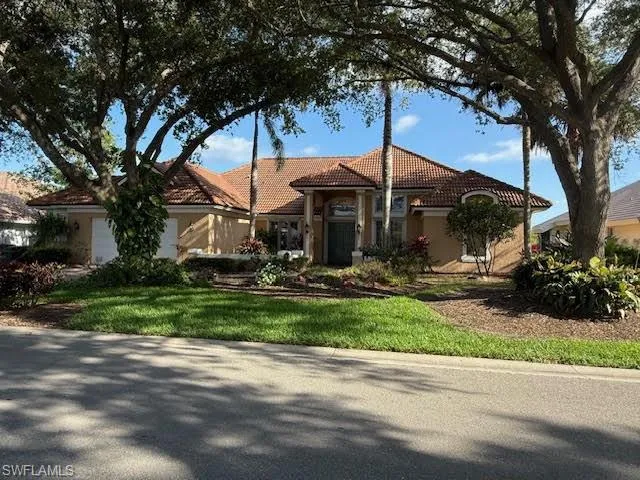 Mediterranean / spanish-style home featuring a tiled roof and stucco siding