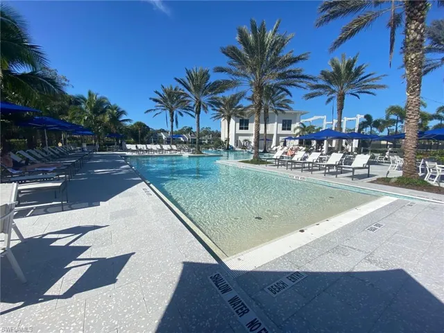 Community pool with a patio