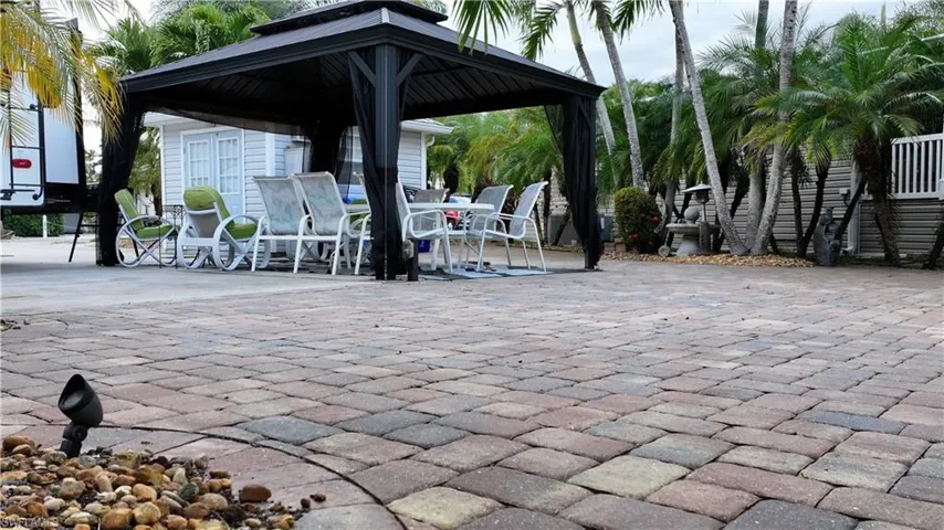 View of patio / terrace with outdoor dining area and a gazebo
