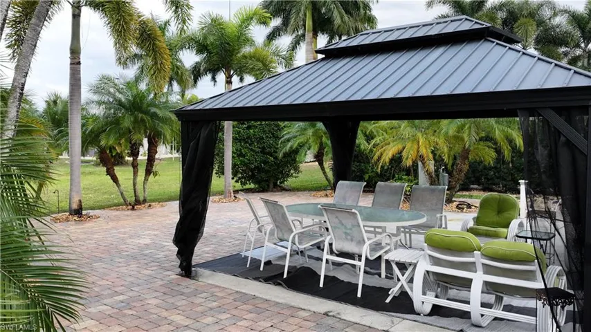 View of patio / terrace featuring a gazebo and outdoor dining area