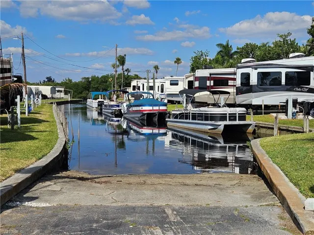 Concrete boat ramp providing direct water access to River via Canal