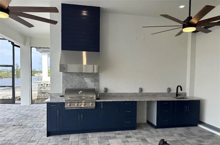 View of swimming pool with a patio area, ceiling fan, and a lanai