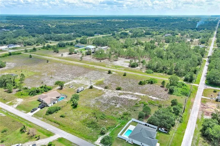 Aerial overview of property's location featuring a heavily wooded area
