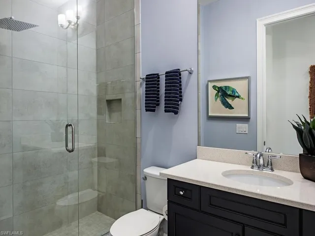 Full bath featuring vanity and a stall shower