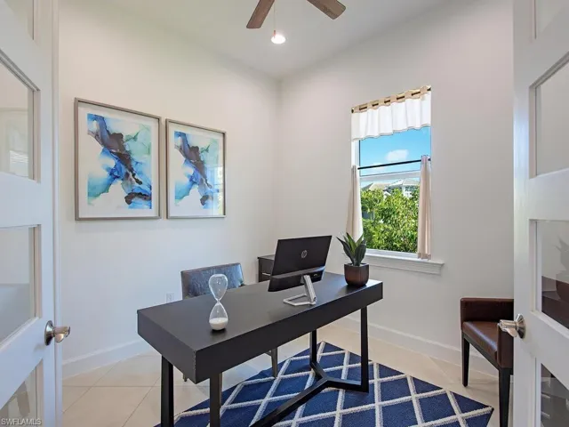 Office area with light tile patterned flooring, recessed lighting, and a ceiling fan