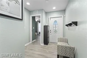 Entrance foyer featuring recessed lighting, baseboards, and light wood finished floors