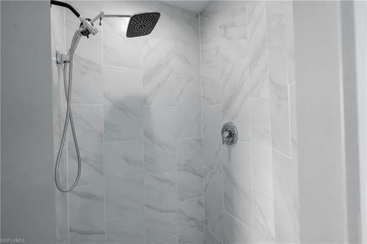 Bathroom featuring tiled shower