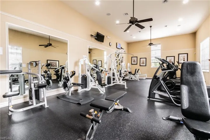 Gym featuring ceiling fan
