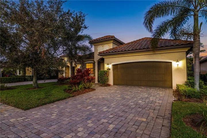 Mediterranean / spanish house with a garage