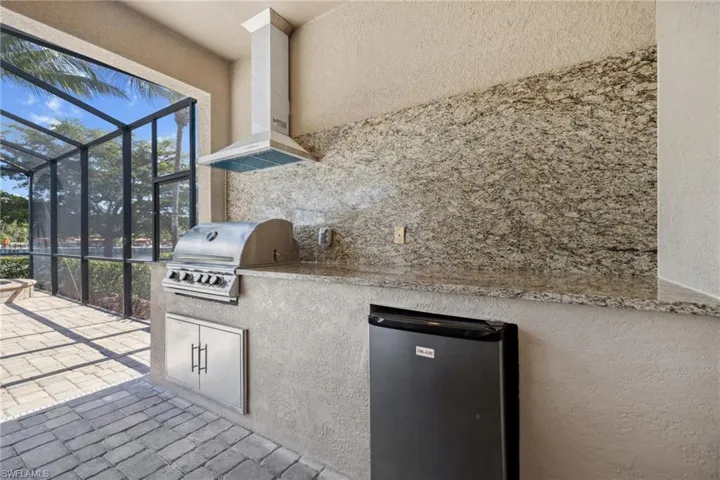 View of patio / terrace with a grill and exterior kitchen