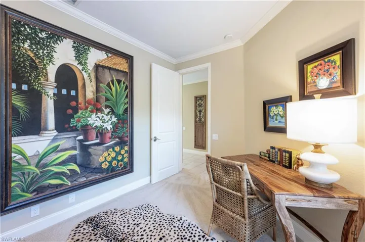 Carpeted home office featuring ornamental molding