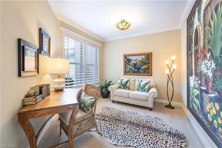 Office area featuring crown molding and carpet floors