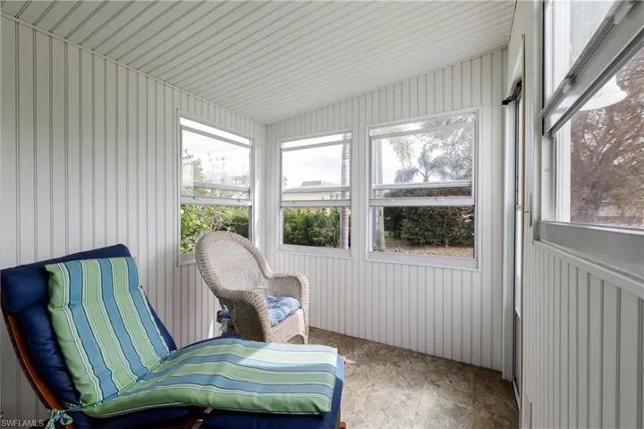 Sunroom/ Back lanai featuring lofted ceiling and plenty of natural light
