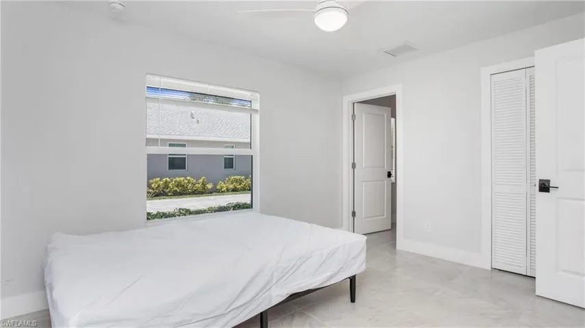 Bedroom with baseboards and a ceiling fan