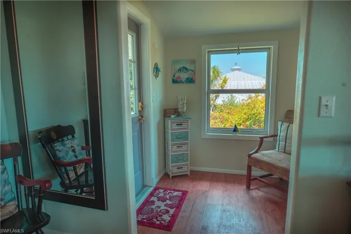 Sitting room featuring wood finished floors and baseboards