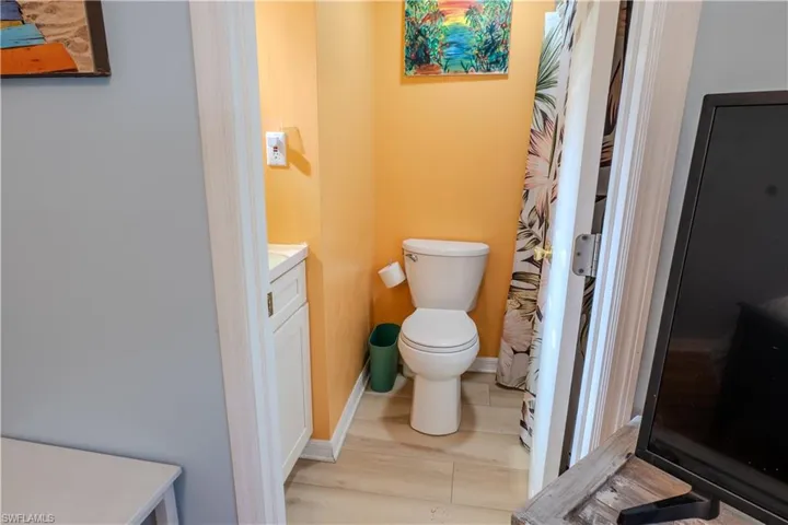 Bathroom featuring vanity and wood finished floors