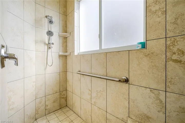 Bathroom featuring a tile shower