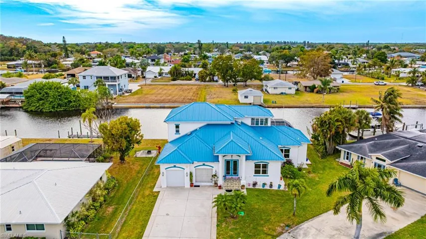Aerial view of residential area with a nearby body of water