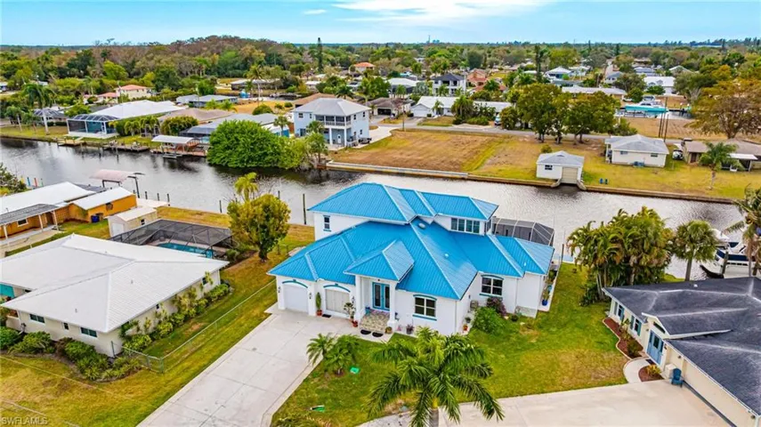 Aerial view of residential area featuring a large body of water