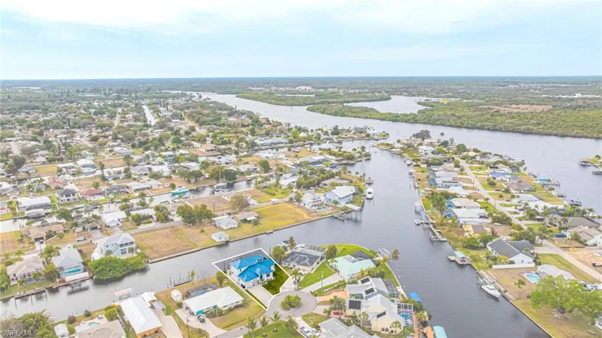 Aerial view of residential area with a nearby body of water