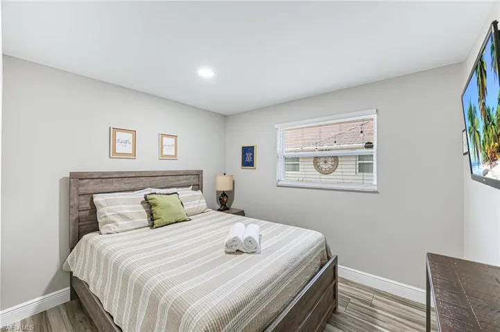 Bedroom featuring wood-type flooring