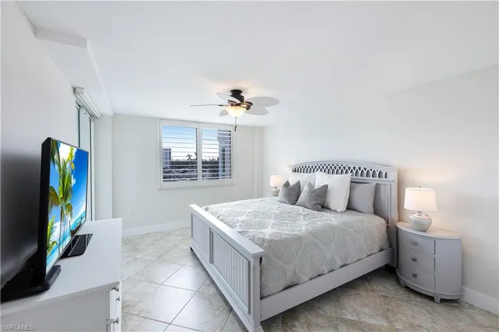 Bedroom with baseboards and a ceiling fan