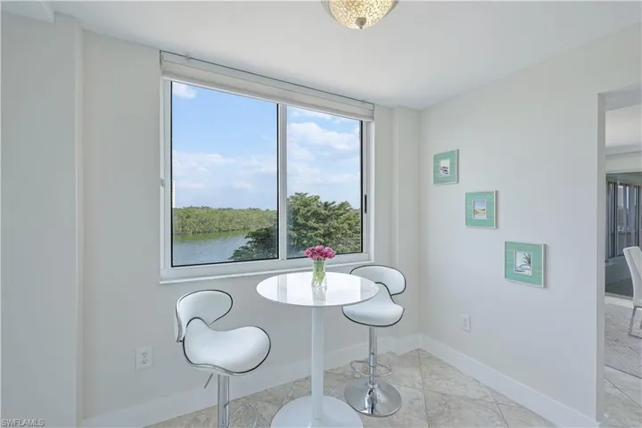 Dining room with baseboards and light tile patterned floors